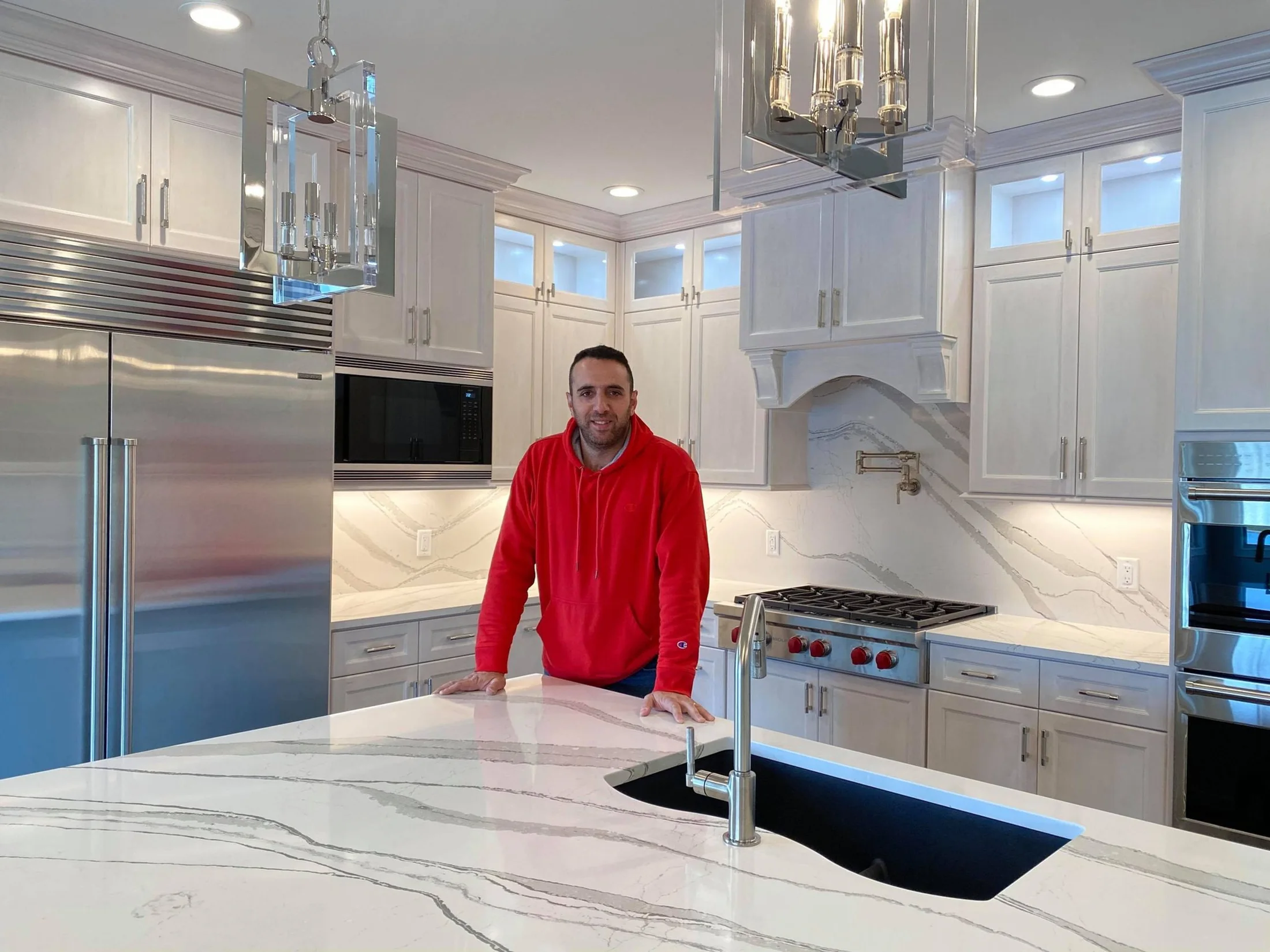 Woodworker in a completed kitchen
